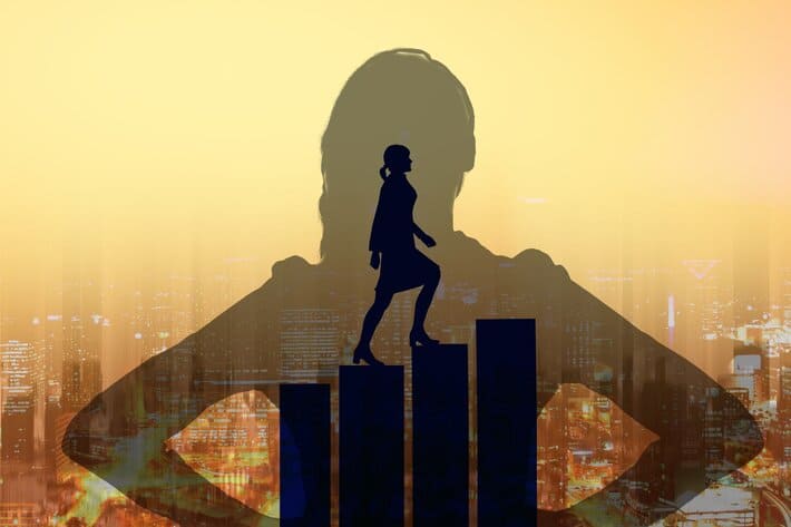 A picture containing a silhouette of a woman and graphical steps with a city image in the background.