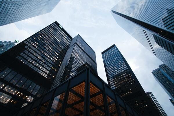 A group of skyscrapers containing corporate offices and advertising firms inside them.