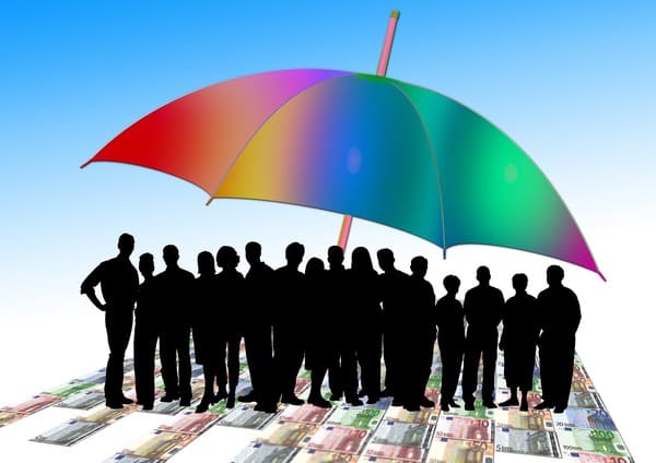 A group of people standing under a large colorful umbrella as loyal customers.